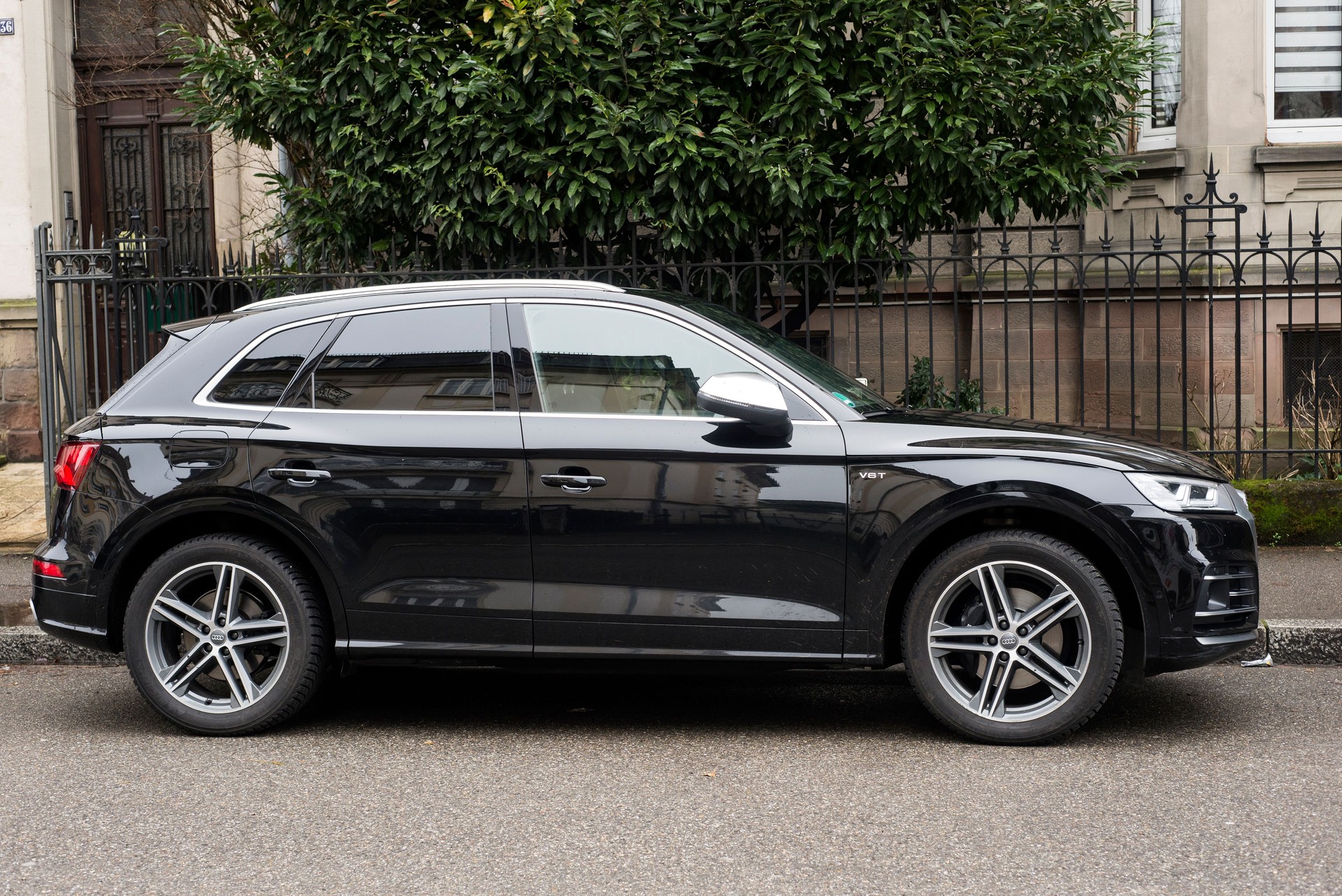 Profile view of black Audi Q5 SUV V6 parked in the street
